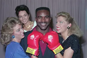 Women Surrounding Evander Holyfield