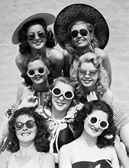Sunbathing Prints: Women in Swimwear Modeling Sunglasses
