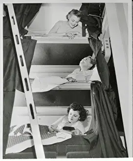 Women Testing a Three-Tier Sleeper