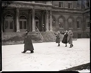 Women Throwing Snowballs at Policeman