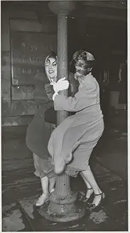 Caution Prints: Women Using Pole for Support