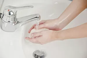 Women washing her hands with soap