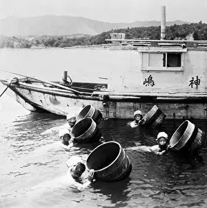 Women in Water With Tubs