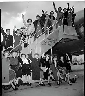 Women Wave as They Board Plane