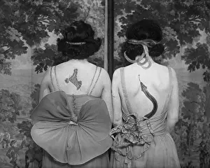 Women wearing tattoos and costumes