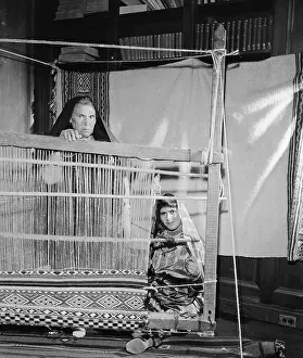 Two Women Weaving