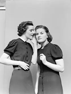 Two women whispering. (Photo by H. Armstrong Roberts / Retrofile / Getty Images)