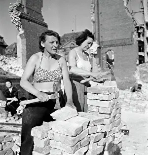 Two Women Workers Chipping Bricks