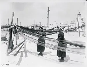 Women Working on Pier with Nets