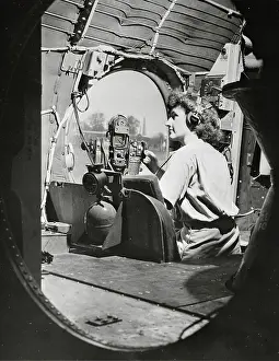 Women's Army Corps Soldier Sitting in Gunner's Seat