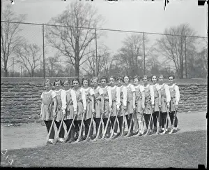 Prints of (Original Caption). Feminine Hockey Aggregation. These members of the gentle sex are not so gentle on the hockey field Frozen Moments: A Journey Through Hockey History: Women's Hockey Team Posing Together