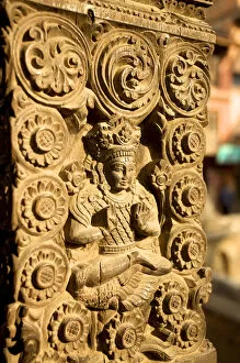 Beam Gallery: Woodcarving with god Shiva on the buttress of a house, Bhaktapur, Nepal, Asia