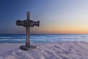 Images Dated 16th December 2014: Wooden cross on a beach at sunset - De Mond, South Africa