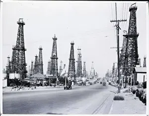 Derrick Prints: Wooden Oil Derricks Surrounding Road