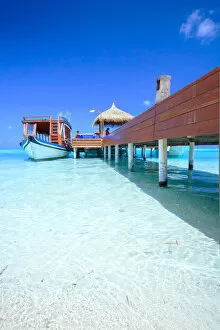 Wooden Gallery: Wooden pier with boat, side view, Maldives