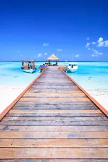 Tropics Gallery: Wooden pier with boats, indian ocean, Maldives