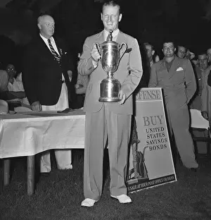 Woods Holds The U.S.G.A. Trophy