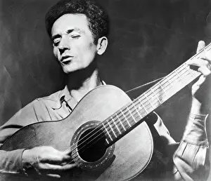 Folk Music Prints: Woody Guthrie Playing the Guitar