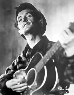 Woody Guthrie Portrait With Guitar