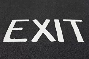Images Dated 29th July 2014: Word Exit painted on a road