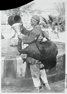 Worker Filling Pigskin with Water