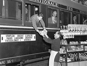 Express Prints: Worker Hands Man on Train Oranges