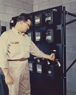 Arco Prints: Worker Holding Light Switch