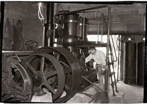 Water Supply Prints: Worker Operating Diesel Engine