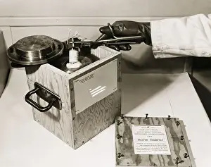 Radioactivity Prints: Worker Placing Radioactive Isotope into Shipping Box