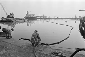 Hose Prints: Worker Pumping Oil From River W/Hose