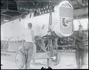 Workers Assembling Aircraft
