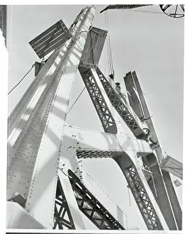 Workers Building Suspension Bridge