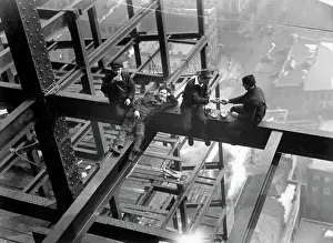 Prints of (Original Caption). New York: The new telephone company skyscraper at Vesey Street and the North River under construction Daredevil Construction Worker Prints: Workers Eating Lunch Atop Beam
