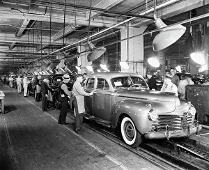 Workers Inspecting Chrysler Imperials on Assembly Line