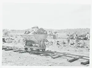 Hard Prints: Workers Loading Wagon with Rocks