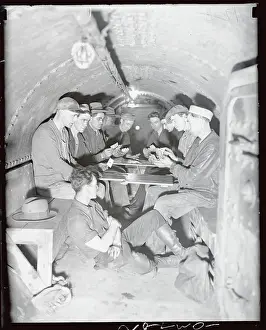 Tunnel Prints: Workers Playing Cards in Subway Tunnel