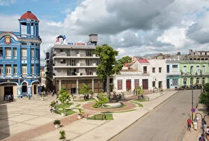 Town Square Collection: The Workers Plaza or Square Including La Cecilia Convention Center (blue building) in Camaguey, Cuba