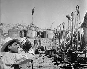 Workers Pointing up to Crane