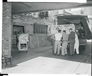Workers Removing Hospital Machinery