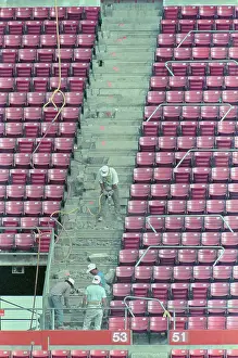 Workers Repairing Earthquake Damaged Baseball Park