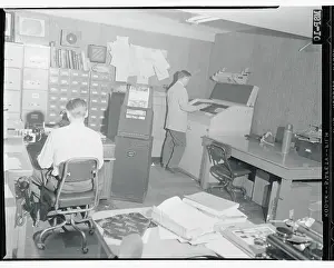 Workers Using the United Press Unifax Machine