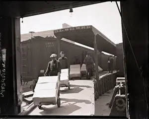 Crate Prints: Workers Wheel Crates Off Loading Dock