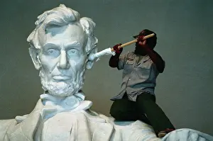Workman Cleaning Ear of Lincoln by Daniel Chester French in the Lincoln Memorial