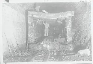 Workman Leaning on Beam