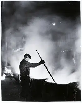 Mold Prints: Workman Removes Scum From Top Of Ingot