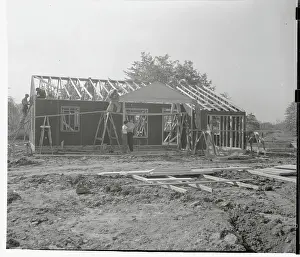 Workmen Constructing House