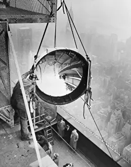 Installing Prints: Workmen Install Light On Empire State