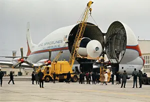 Heavy Prints: Workmen Unloading Cargo from a Super Guppy Plane