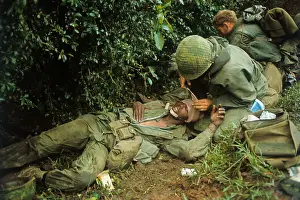 Wounded US Marine Being Treated by Medic