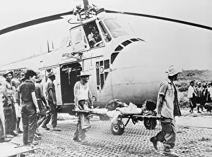 Laos Prints: Wounded Soldier Taken from Helicopter